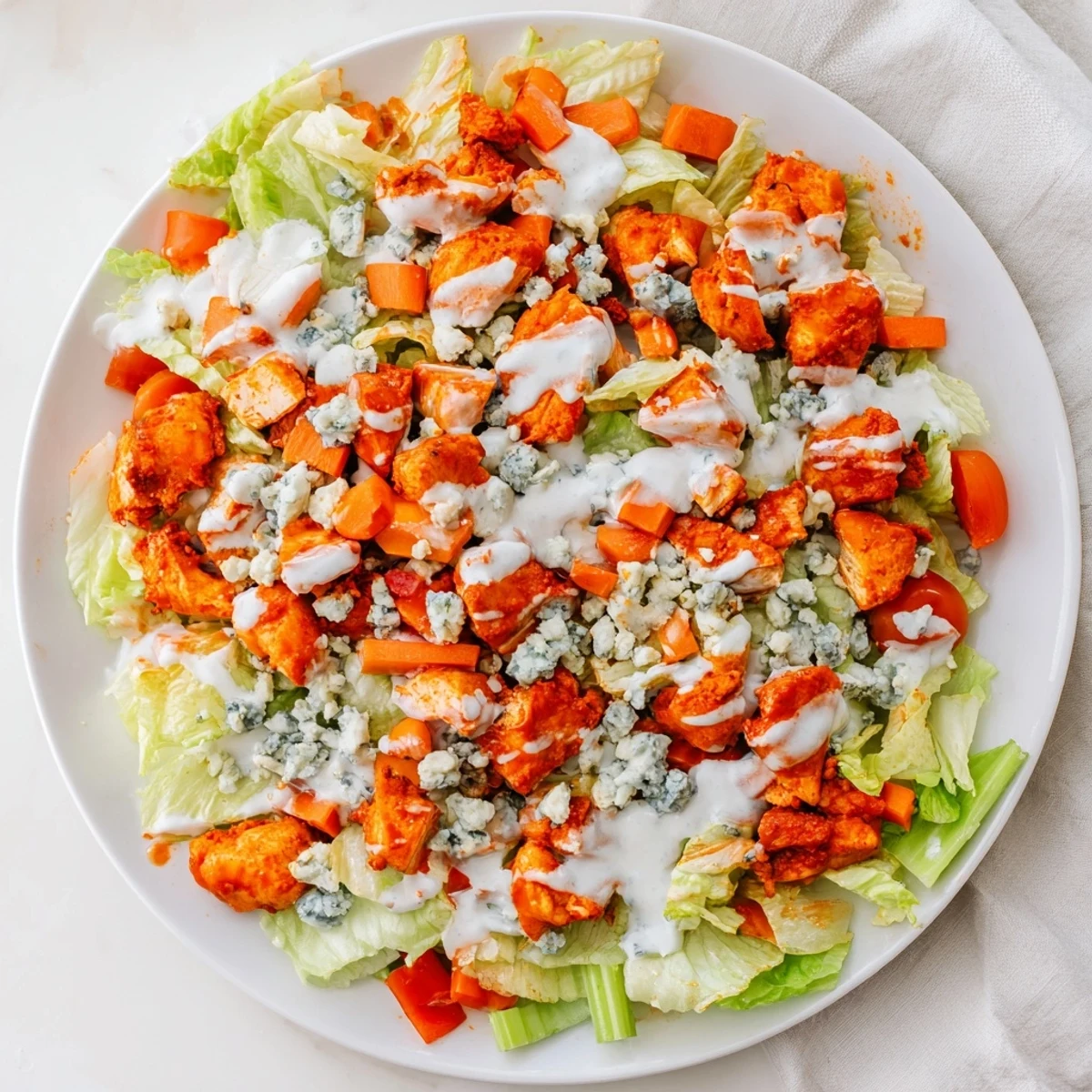 Freshly chopped romaine and spicy Buffalo chicken tossed with crisp celery and crumbled blue cheese.