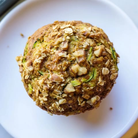 Golden-brown freezer-friendly breakfast muffins, slightly domed, ready for a grab-and-go experience.