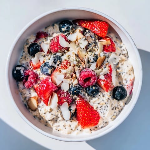 Close-up of vibrant overnight oats with berries, a make-ahead breakfast perfect for busy mornings.