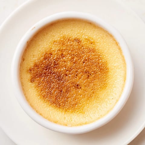 A perfectly set 3-Ingredient Crème Brûlée, showing the smooth custard under the brittle burnt sugar.