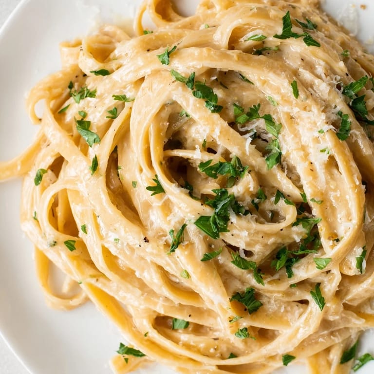 Served in a rustic bowl, this vegetarian Sriracha Honey Pasta pairs perfectly with a crisp white wine.